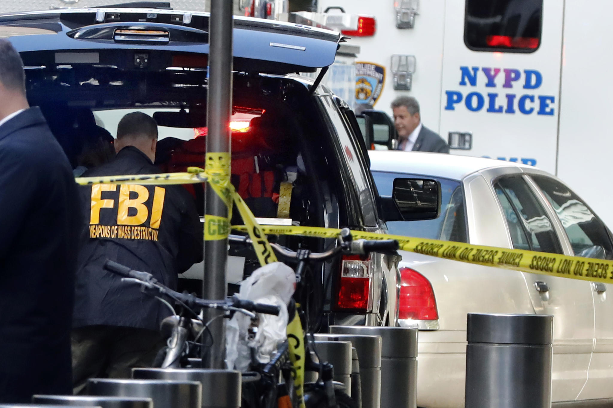 A member of the FBI Weapons of Mass Destruction team works outside the Time Warner Center, in New York, Wednesday, Oct. 24, 2018. A police bomb squad was sent to CNN's offices in New York City and the newsroom was evacuated because of a suspicious package. (AP Photo/Richard Drew)