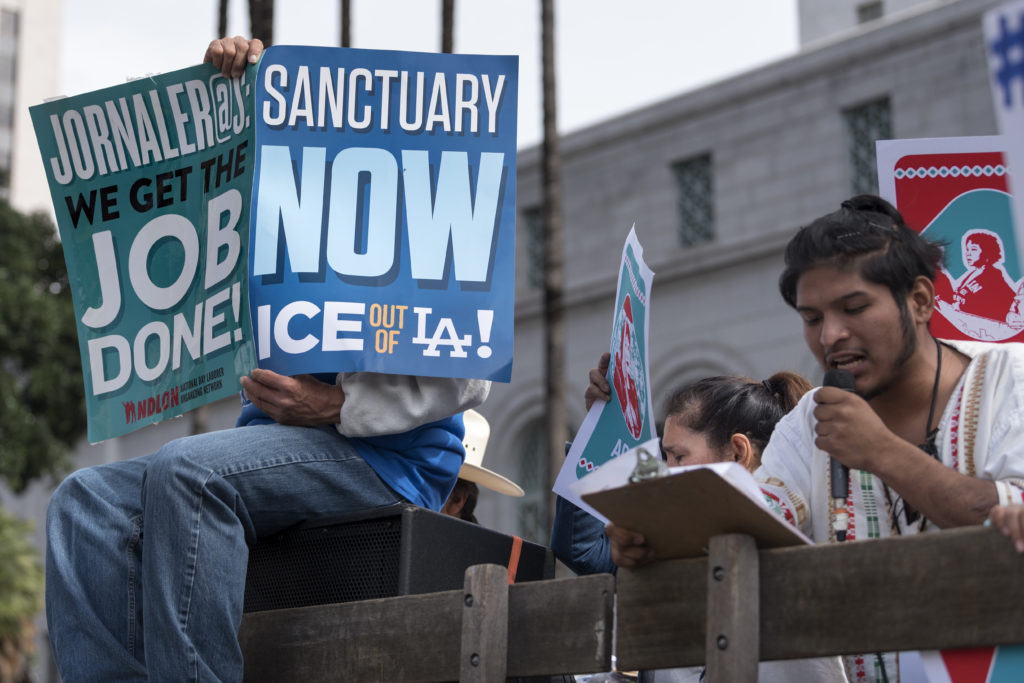 Protesters at a pro-immigration rally where organizers called for a stop to the Immigration and Customs Enforcement (ICE) raids and deportations of illegal immigrants and to officially establish Los Angeles as a sanctuary city. Los Angeles, California February 18, 2017.  (Photo by Ronen Tivony/NurPhoto via Getty Images)